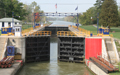 The gates of Lock 30 along the Erie Canal opens to let a boat in.