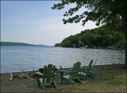 Empty chairs look out over Canandaigua Lake in the Finger Lakes, New York USA.